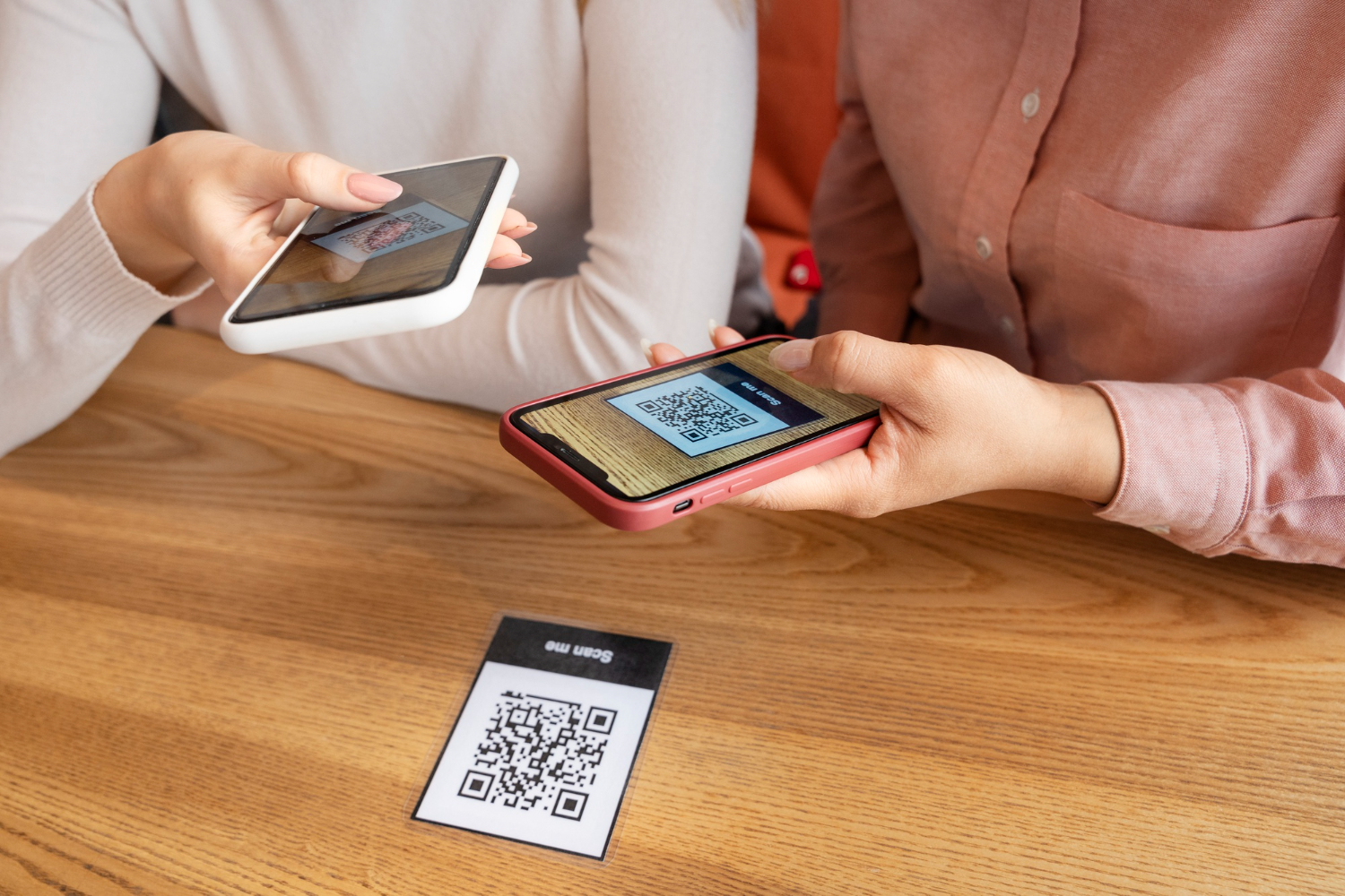 A person scanning a QR code using a smartphone for a digital stamp collection.