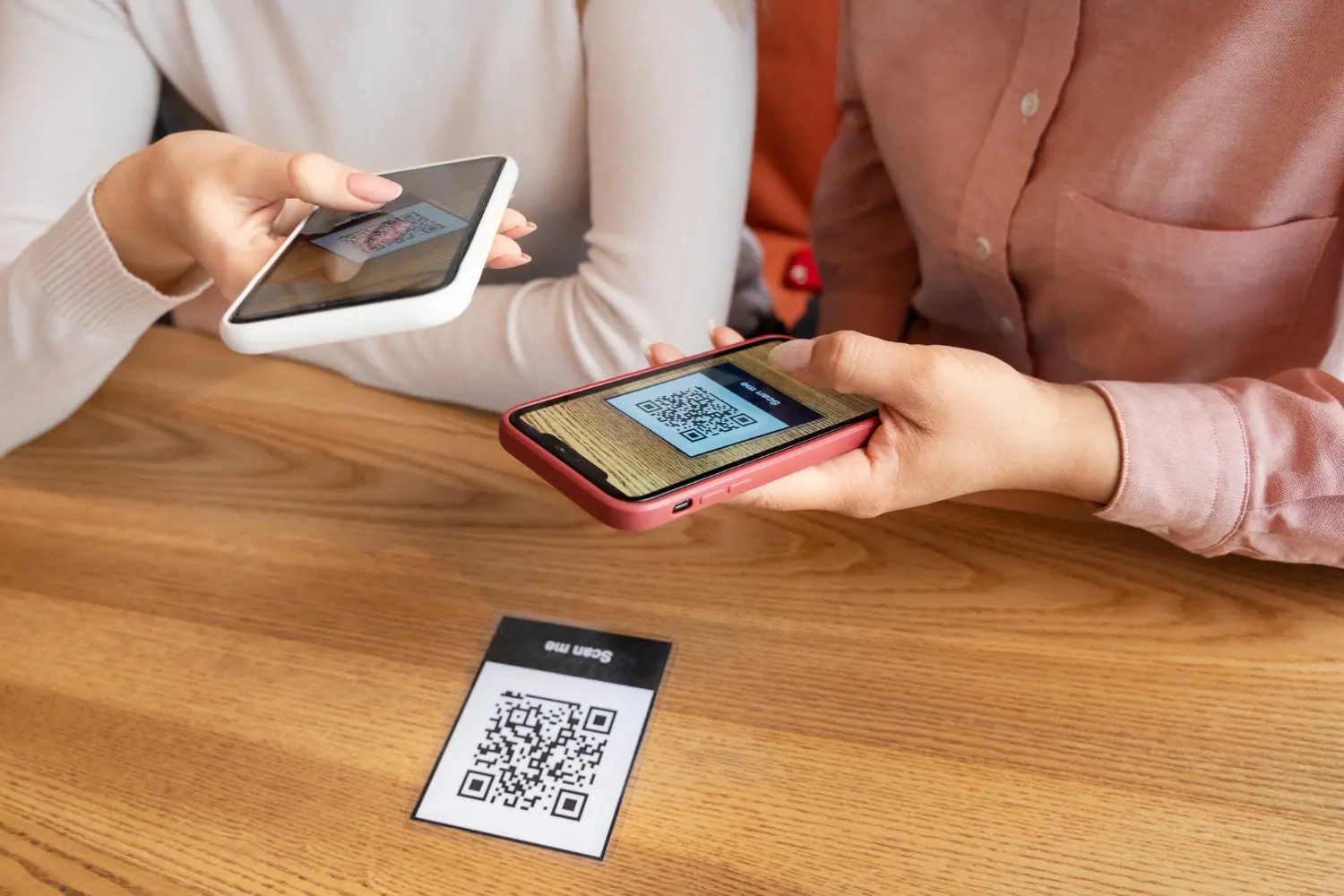 A person scanning a QR code using a smartphone for a digital stamp collection.